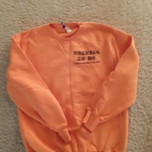 Sweat shirt by DIVIDED. Size small. Orange in color